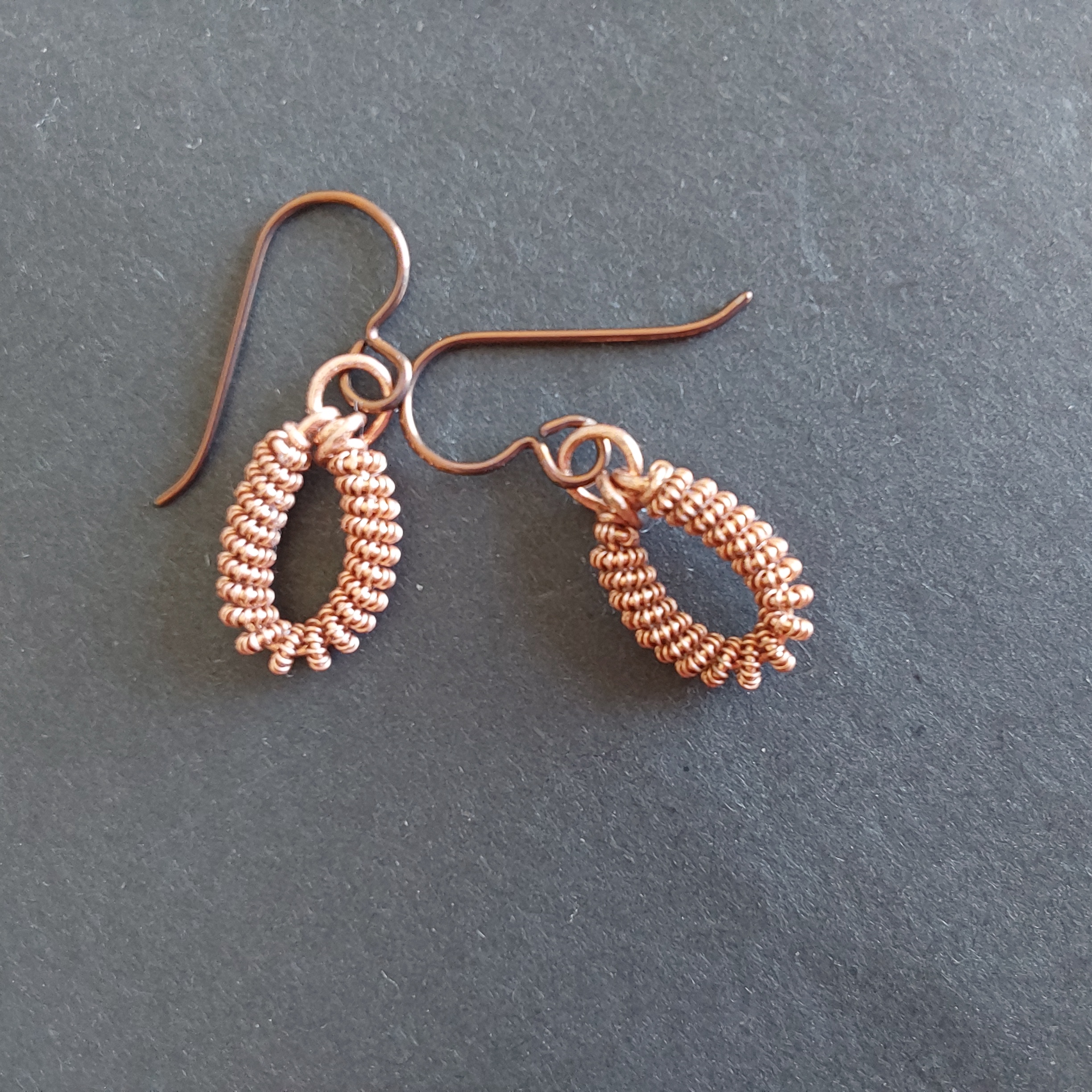 Handmade copper coiled coil dangly earrings with Niobium hypoallergenic ear wires.