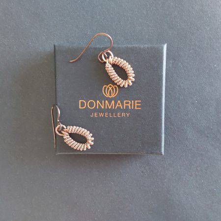 Handmade copper coiled coil dangly earrings with Niobium hypoallergenic ear wires.