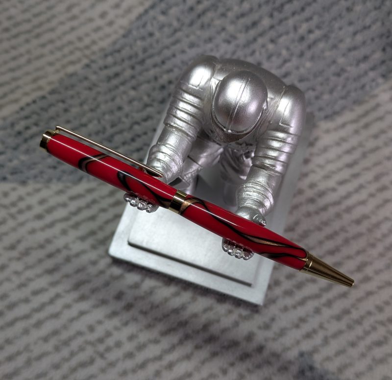 Slimline twist pen in red acrylic with gold coloured fittings
