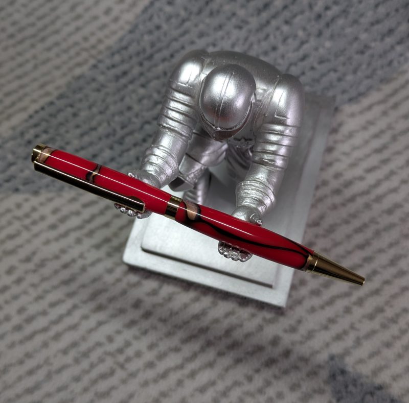 Slimline twist pen in red acrylic with gold coloured fittings