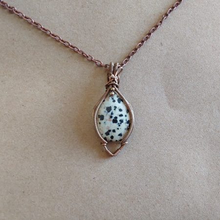 Antiqued copper wire wrapped Dalmation Jasper cabochon pendant with 18 inch copper colour chain and free Tracked postage.