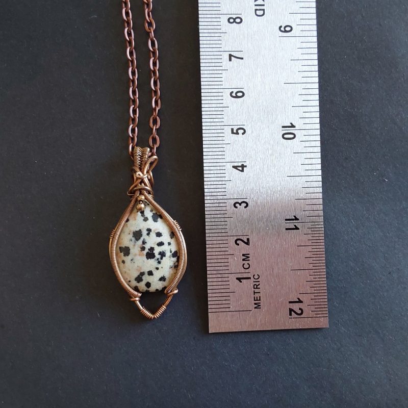 Antiqued copper wire wrapped Dalmation Jasper cabochon pendant with 18 inch copper colour chain and free Tracked postage.