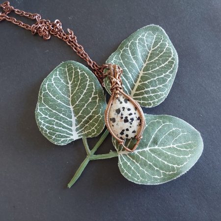 Antiqued copper wire wrapped Dalmation Jasper cabochon pendant with 18 inch copper colour chain and free Tracked postage.