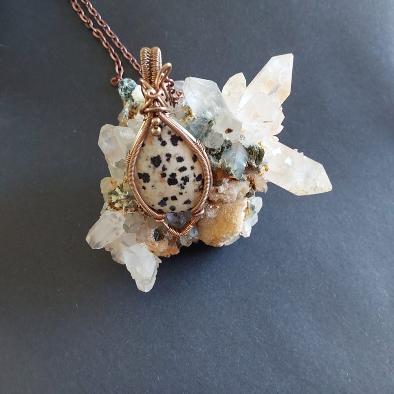 Antiqued copper wire wrapped Dalmation Jasper cabochon pendant with 18 inch copper colour chain and free Tracked postage.