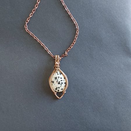 Antiqued copper wire wrapped Dalmation Jasper cabochon pendant with 18 inch copper colour chain and free Tracked postage.