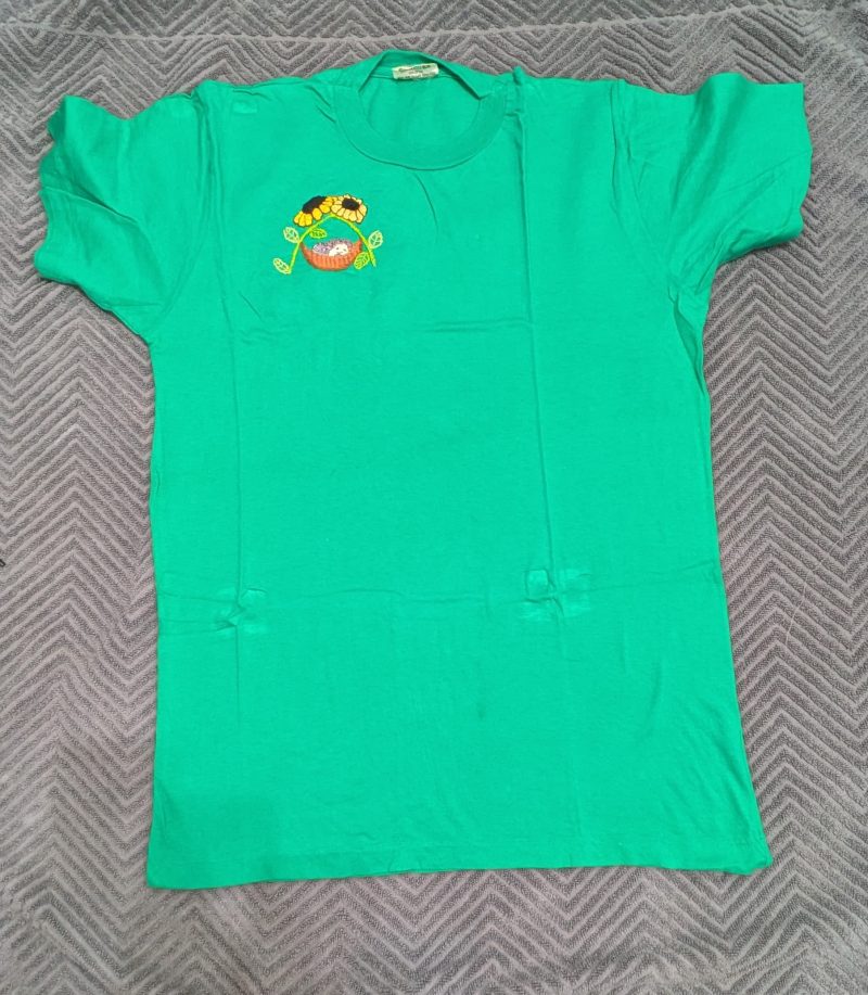 HEDGEHOG SLEEPING IN A HAMMOCK UNDER SUNFLOWERS