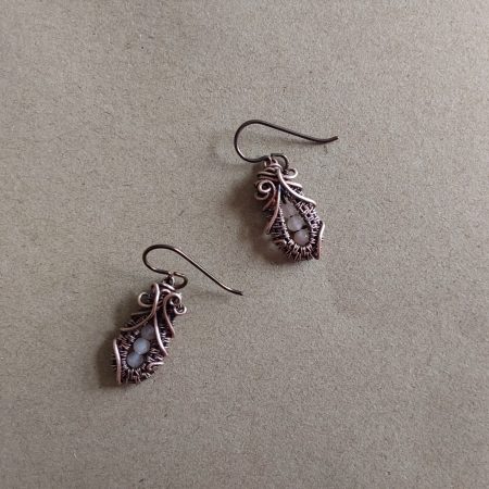 Faceted Peach Moonstone 'Ballet Shoe' style earrings with hypoallergenic ear wires. The wire weave component of each earring is approximately 1/2 an inch (2cm) in length plus ear wire length of 2 cm.