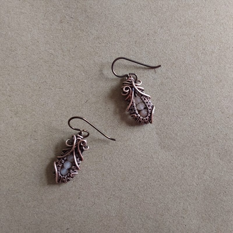 Faceted Peach Moonstone 'Ballet Shoe' style earrings with hypoallergenic ear wires. The wire weave component of each earring is approximately 1/2 an inch (2cm) in length plus ear wire length of 2 cm.