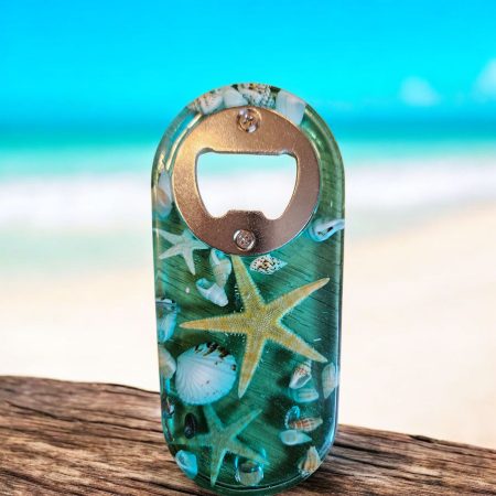 Beach themed nautical resin bottle opener with starfish & shells.