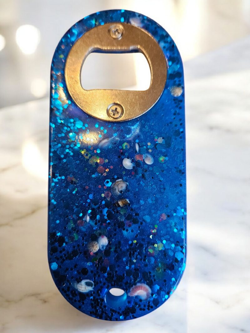 Blue beach themed nautical resin bottle opener with starfish, shells & glitter