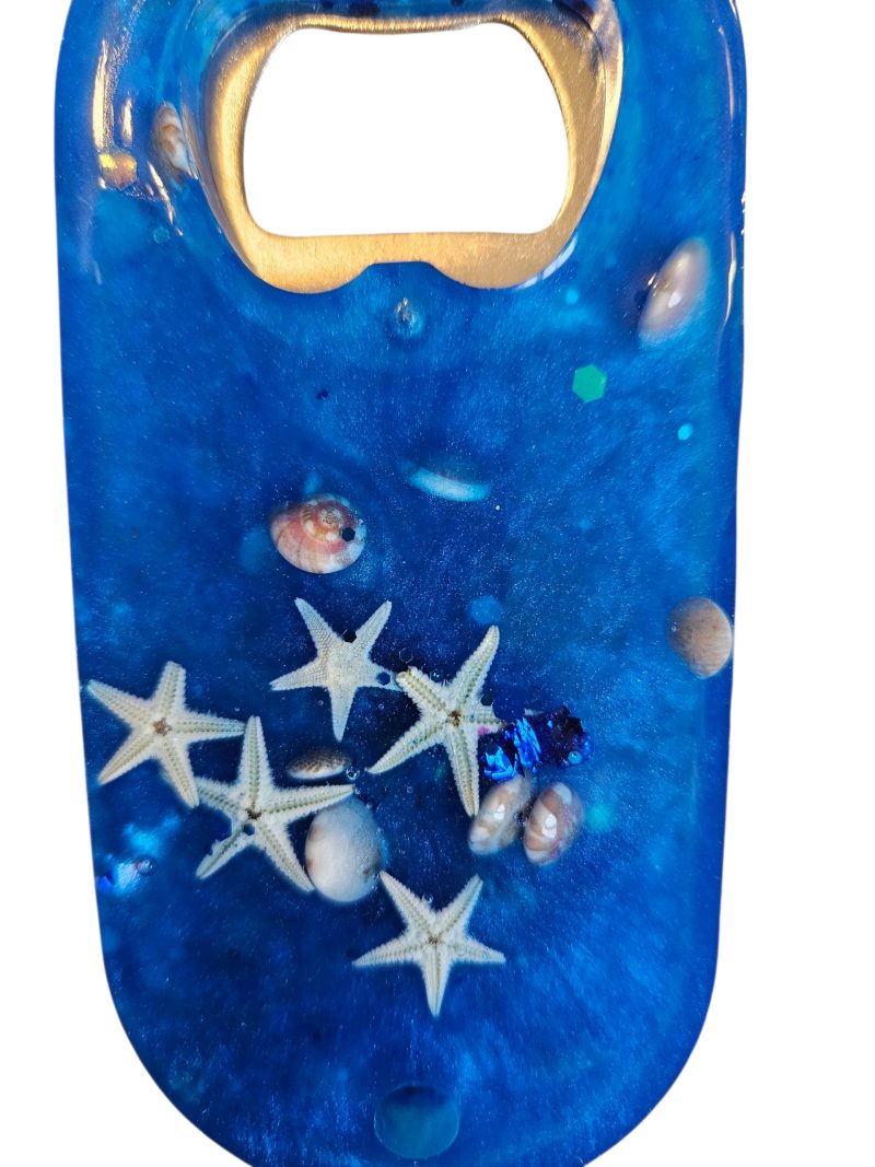 Blue beach themed nautical resin bottle opener with starfish, shells & glitter