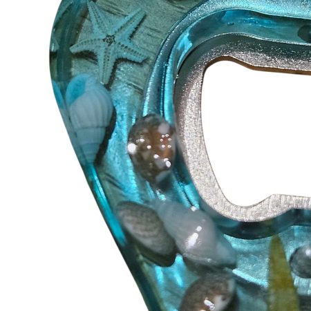 Sea themed resin bottle opener with real sea shells & starfish.