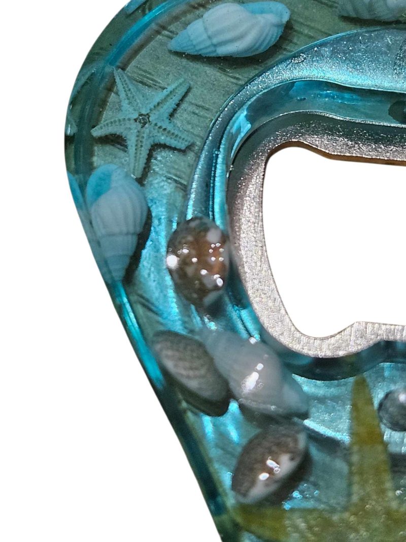Sea themed resin bottle opener with real sea shells & starfish.