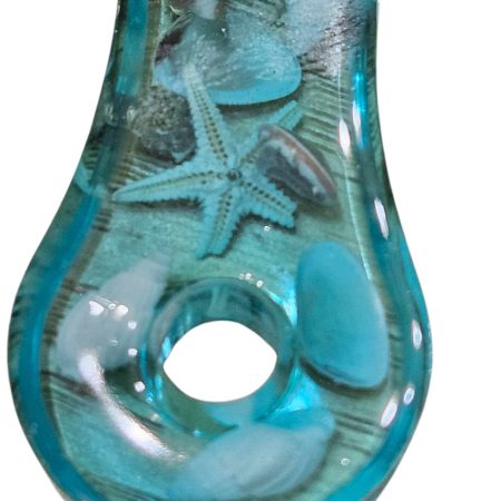 Sea themed resin bottle opener with real sea shells & starfish.