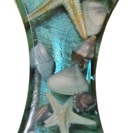 Sea themed resin bottle opener with real sea shells & starfish.