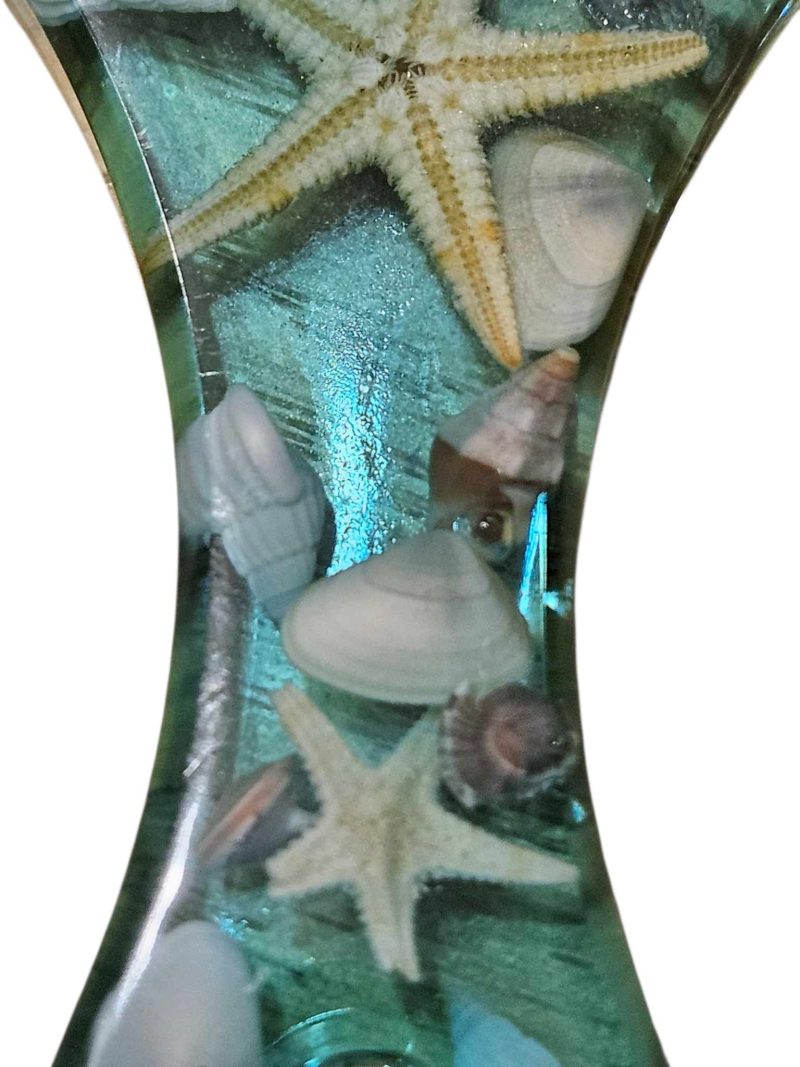 Sea themed resin bottle opener with real sea shells & starfish.