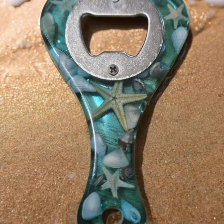 Sea themed resin bottle opener with real sea shells & starfish.