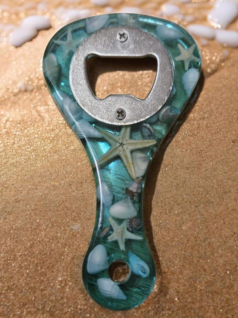 Sea themed resin bottle opener with real sea shells & starfish.