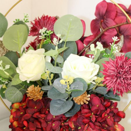 Table centre piece with gold hoop Hydrangea, roses and eucalyptus