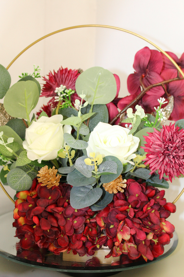 Table centre piece with gold hoop Hydrangea, roses and eucalyptus