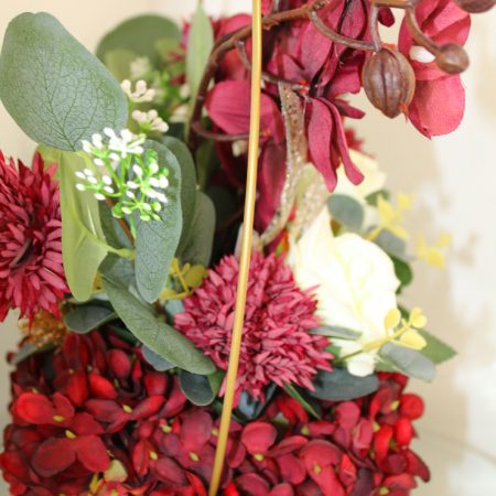 Table centre piece with gold hoop Hydrangea, roses and eucalyptus