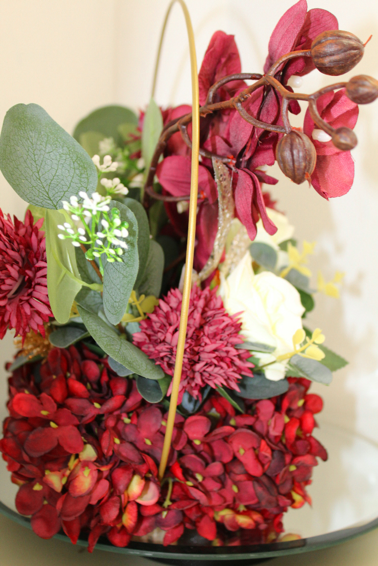Table centre piece with gold hoop Hydrangea, roses and eucalyptus