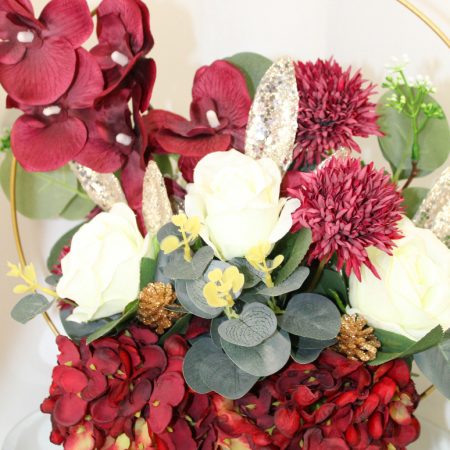 Table centre piece with gold hoop Hydrangea, roses and eucalyptus