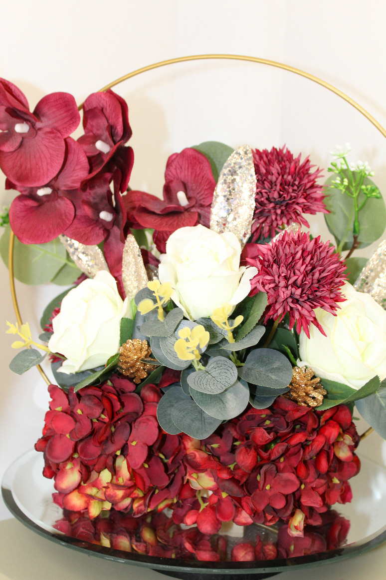 Table centre piece with gold hoop Hydrangea, roses and eucalyptus