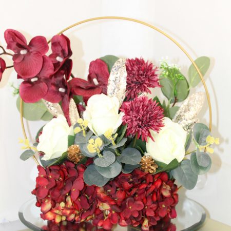 Table centre piece with gold hoop Hydrangea, roses and eucalyptus
