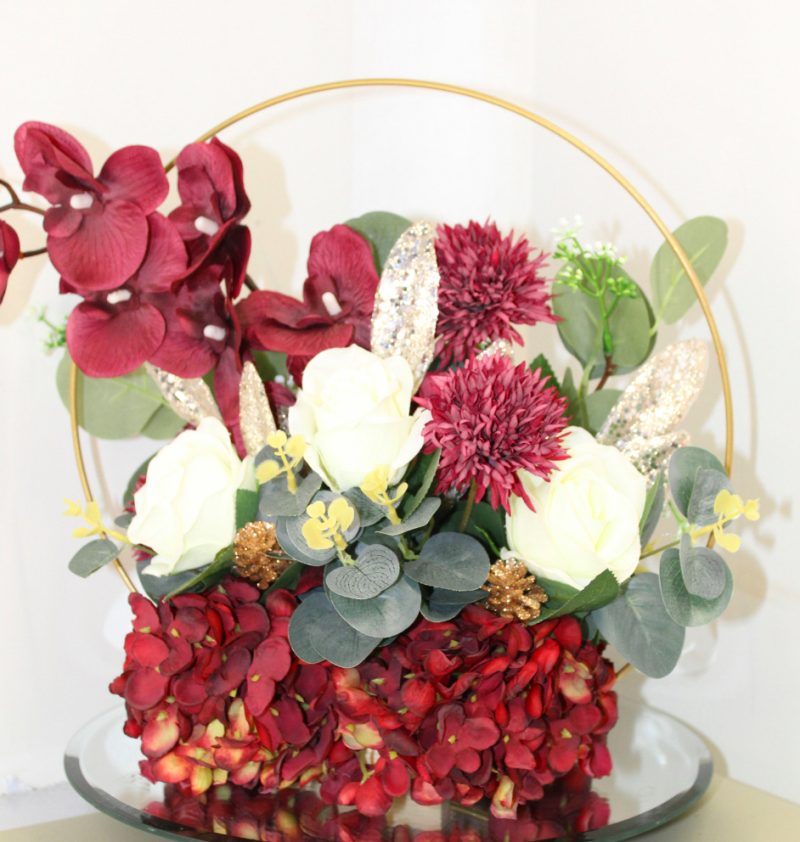 Table centre piece with gold hoop Hydrangea, roses and eucalyptus