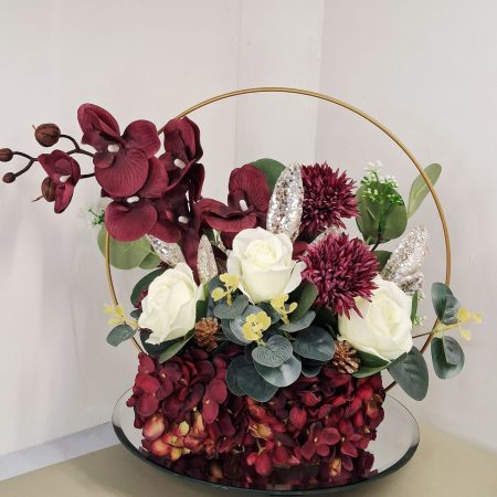 Table centre piece with gold hoop Hydrangea, roses and eucalyptus
