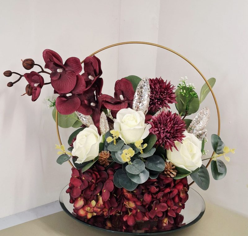 Table centre piece with gold hoop Hydrangea, roses and eucalyptus