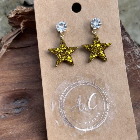 Gold glittery resin star stud earrings