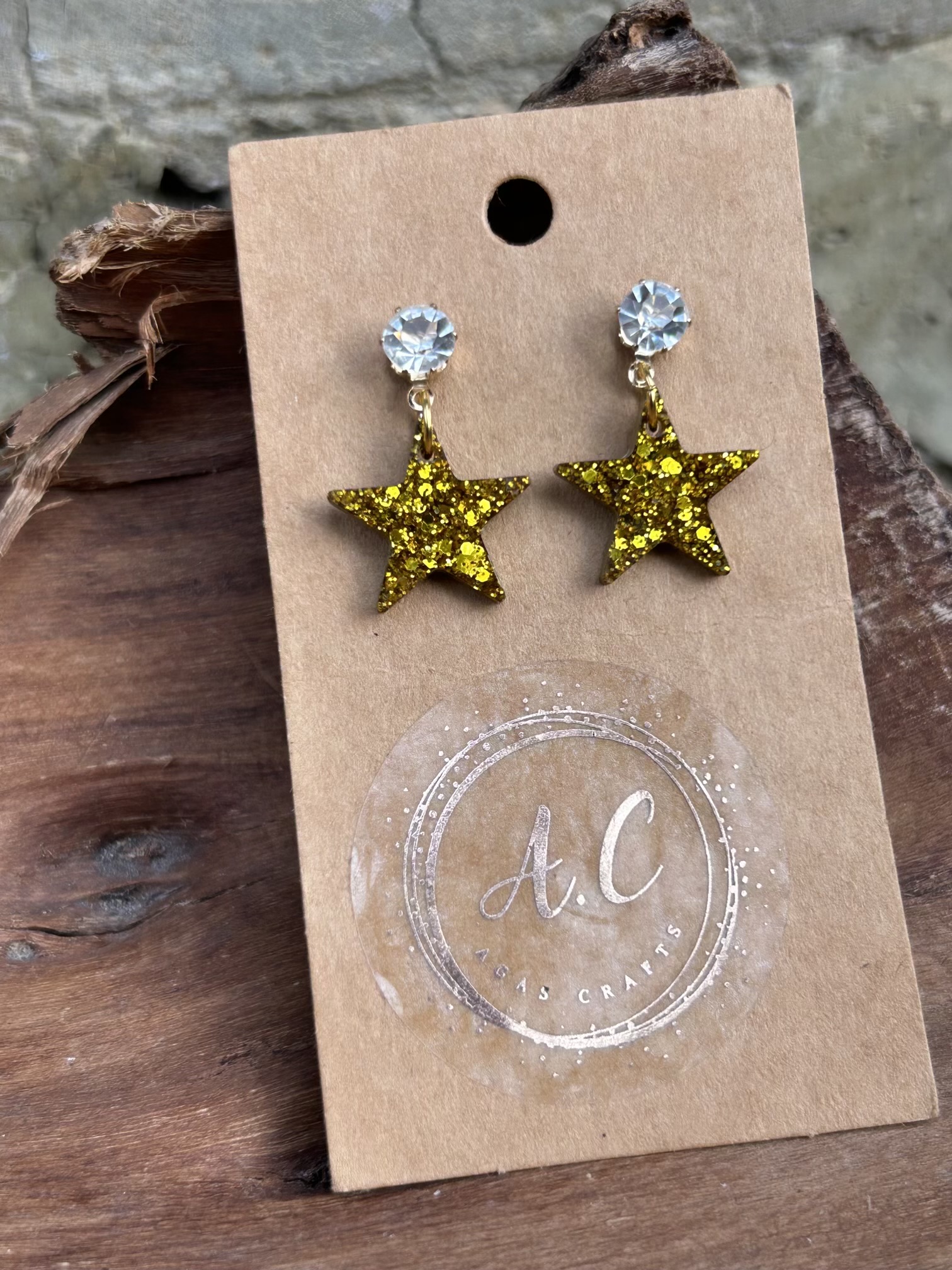 Gold glittery resin star stud earrings