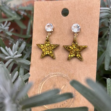Gold glittery resin star stud earrings