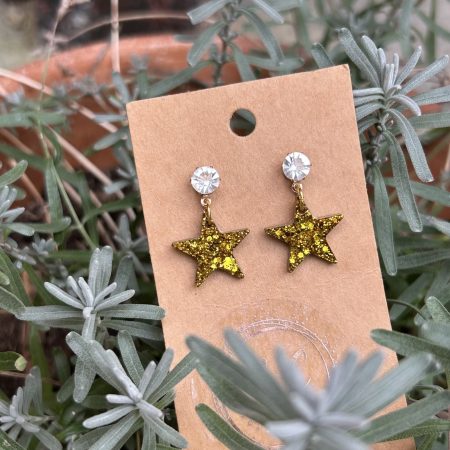 Gold glittery resin star stud earrings