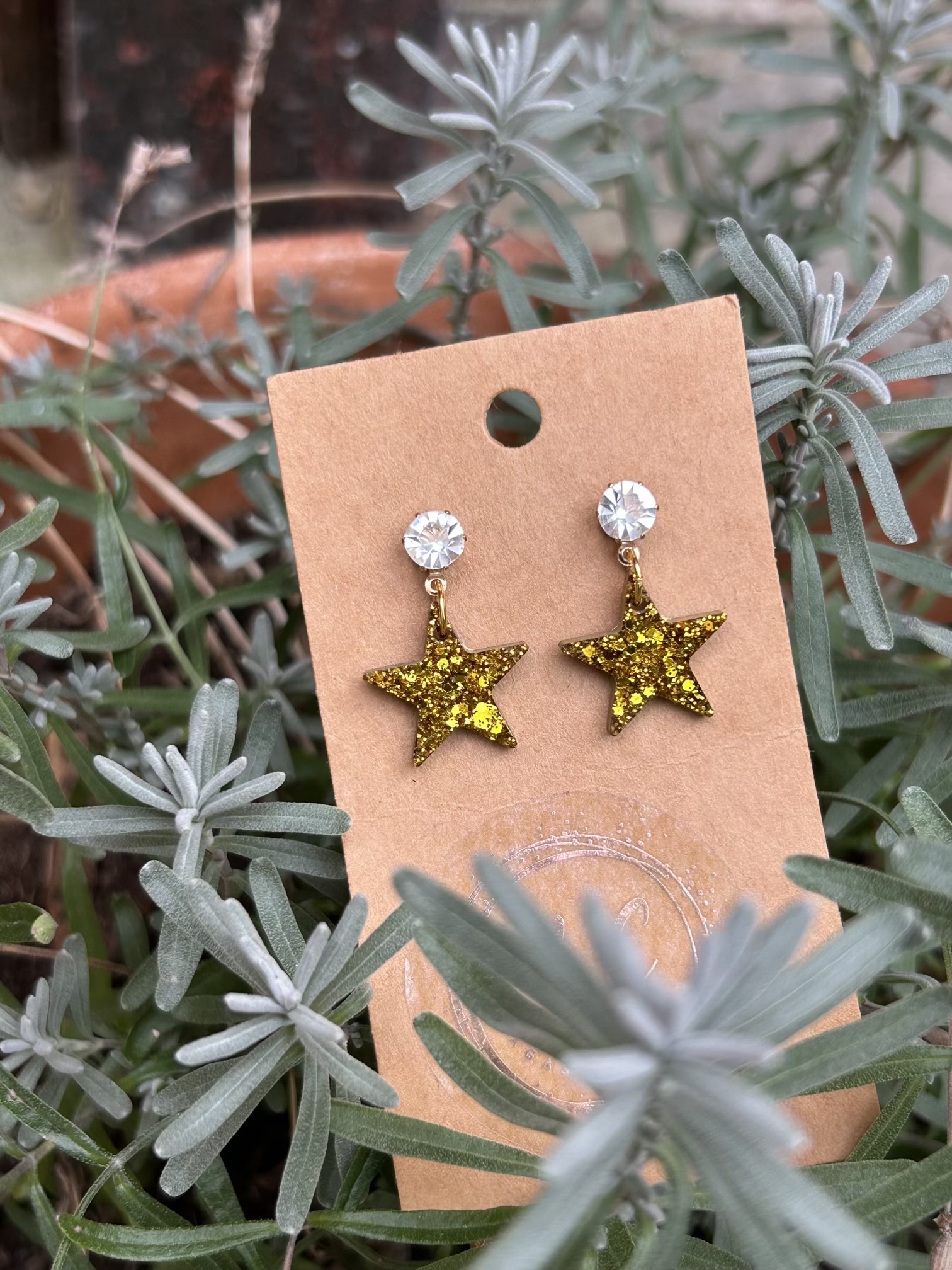 Gold glittery resin star stud earrings
