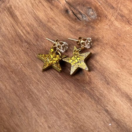 Gold glittery resin star stud earrings