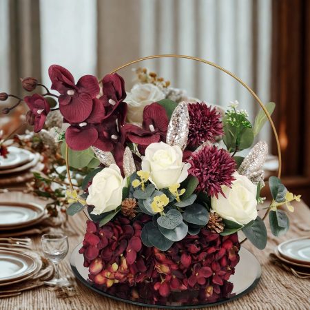 Table centre piece with gold hoop Hydrangea, roses and eucalyptus