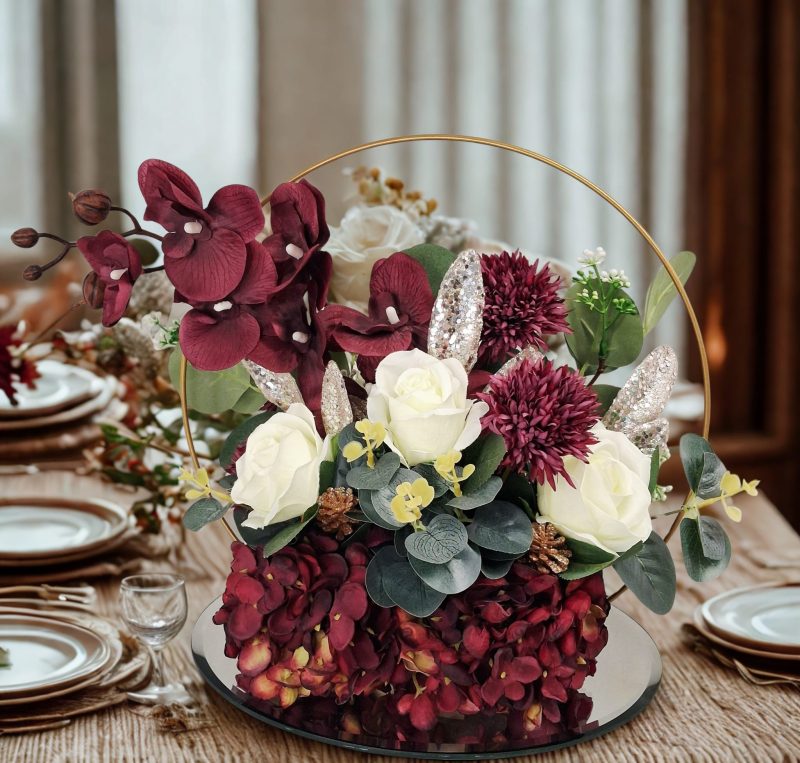 Table centre piece with gold hoop Hydrangea, roses and eucalyptus