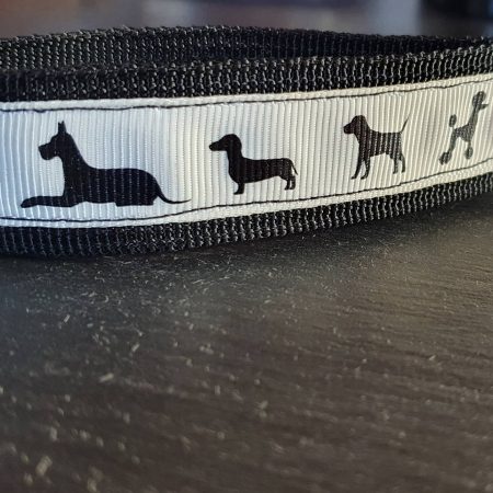 Dog breeds print fabric key fob with a cream background