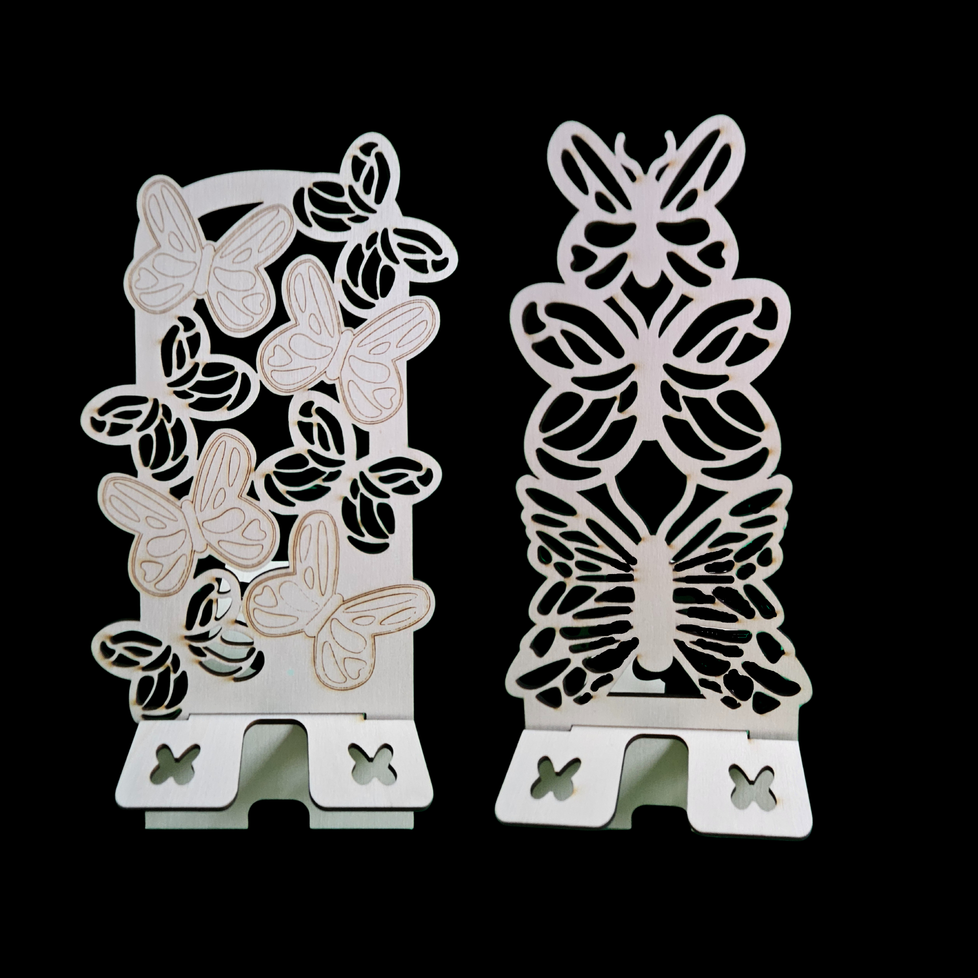 Two Butterfly Mobile Telephone Stands Of Different Designs