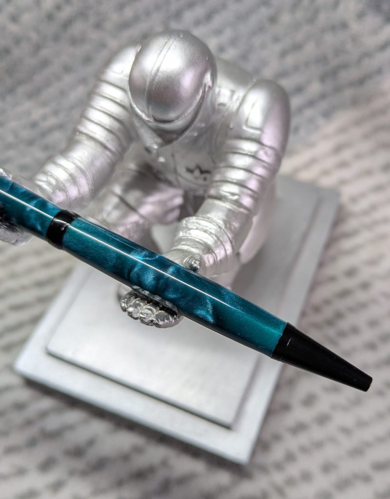 Slimline twist ballpoint pen in teal acrylic and black fittings