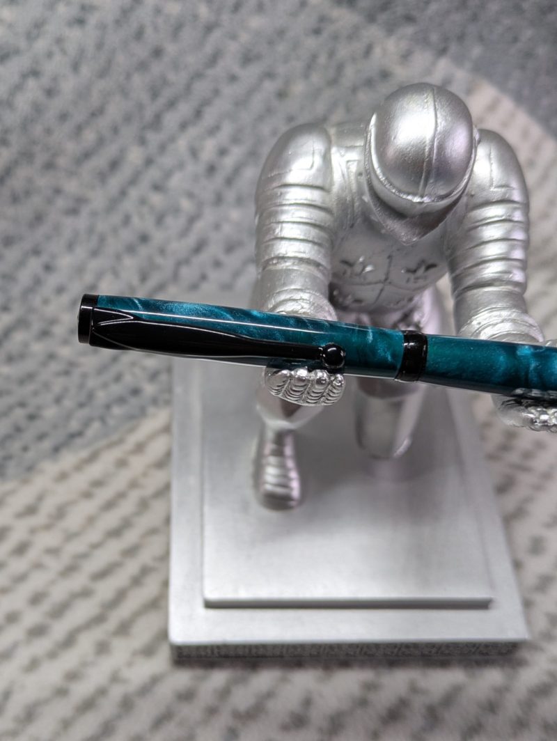 Slimline twist ballpoint pen in teal acrylic and black fittings