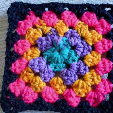 Granny square coasters pack of 4. Brights and Black