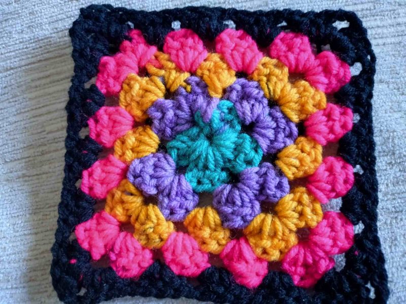 Granny square coasters pack of 4. Brights and Black