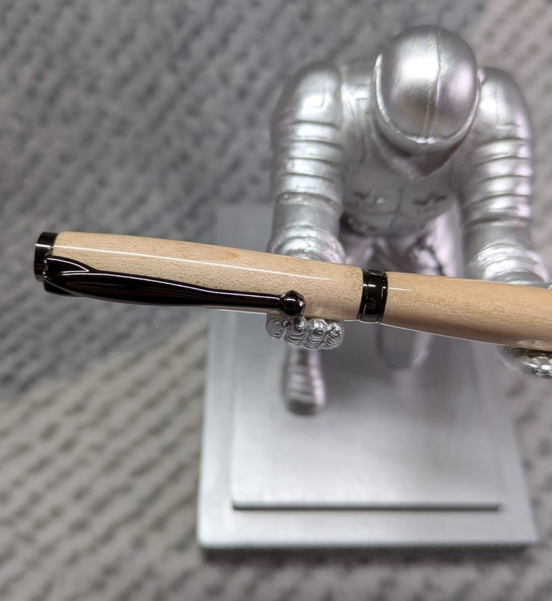 Slimline twist ballpoint pen made from maple with gun metal fittings