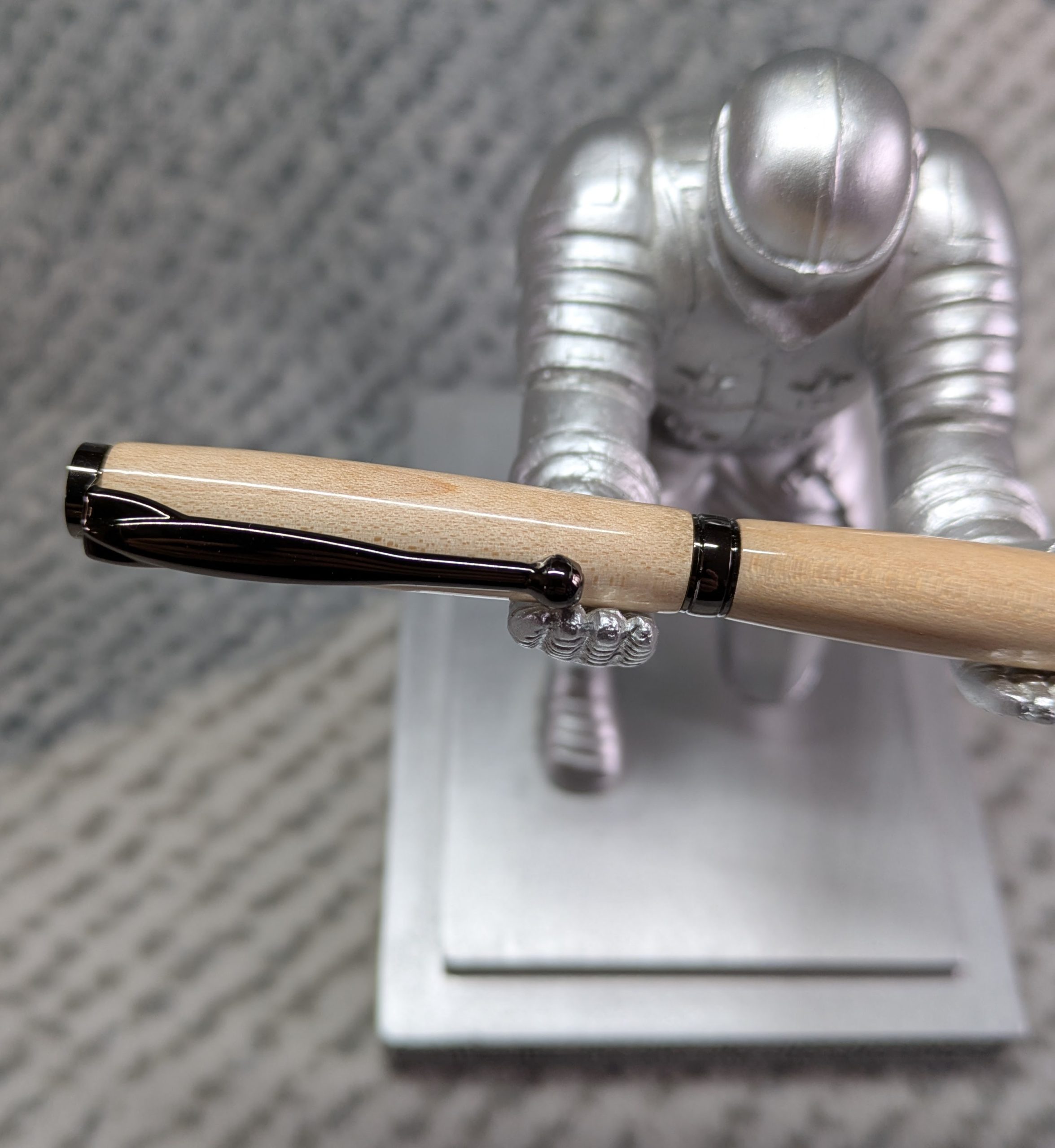 Slimline twist ballpoint pen made from maple with gun metal fittings