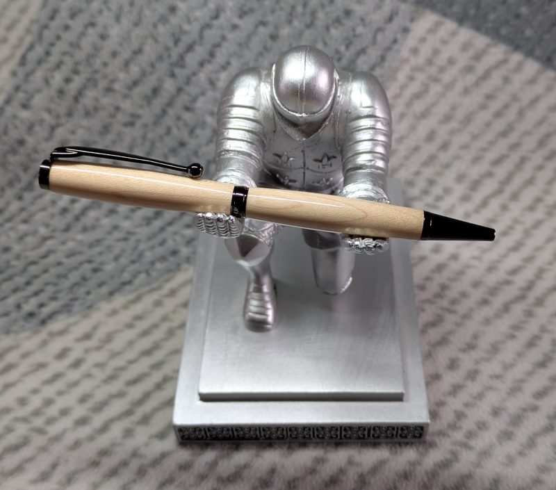 Slimline twist ballpoint pen made from maple with gun metal fittings