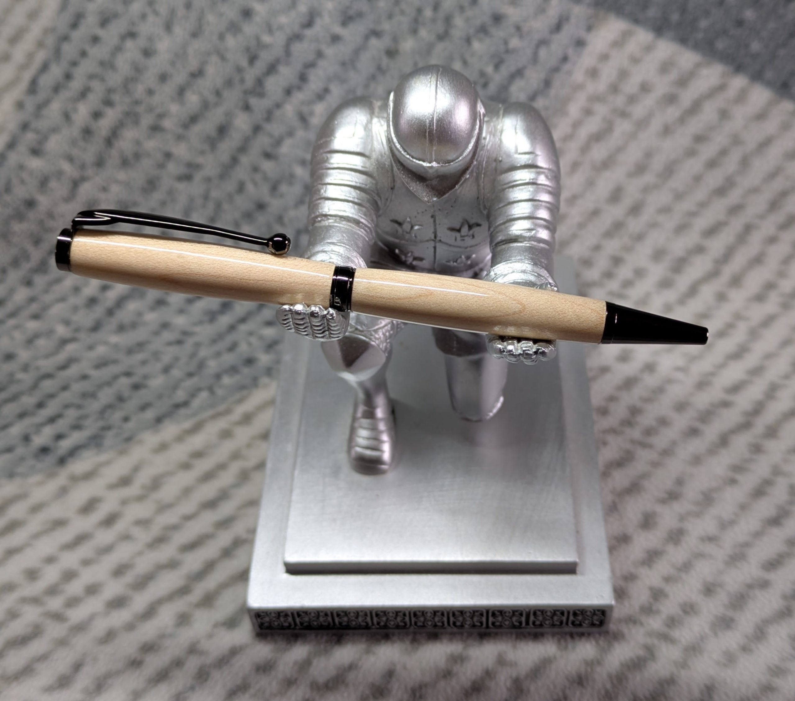 Slimline twist ballpoint pen made from maple with gun metal fittings